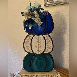 TRIO OF STACKED, HANDPAINTED PUMPKINS ON WOOD